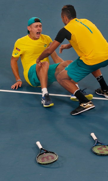 Heated Medvedev wins QF for Russia; Australia beats Britain